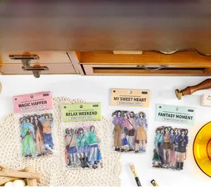 Detailed close-up of fashion illustration PET stickers on a vintage wooden desk setup