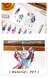 Detailed PET stickers showing fashion anime girl designs on a journal with soft lighting