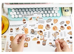 Detail of coffee and bakery PET stickers on a vintage keyboard background