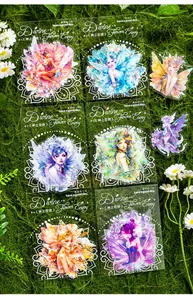 Detail of Divine Flower Envoy stickers featuring fairy motifs on a natural moss background