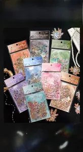 Macro shot of laser gold PET feather stickers with shells on retro background