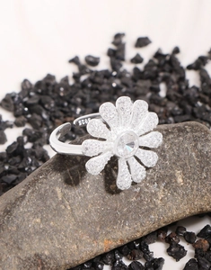 Detailed macro view of S925 sterling silver daisy ring with sparkling zircon center