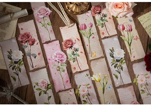 Detail of vintage flower bookmarks with retro floral designs and aged paper texture