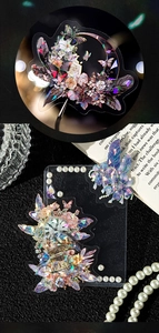 Macro view of holographic PET stickers featuring vintage feathers and clock designs