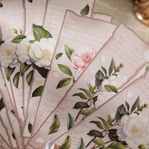 Vintage floral bookmarks set with camellia patterns and poetic script on wood background