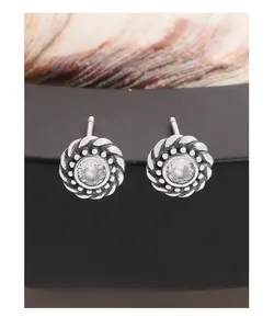 Detailed close-up of S925 sterling silver twist earrings with round zircon stones