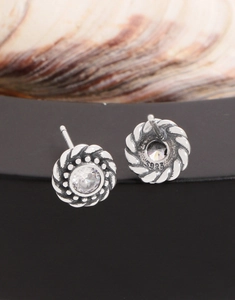 Macro detail of S925 sterling silver twist stud earrings with sparkling cubic zirconia