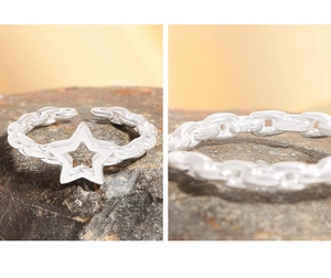 Detailed view of S925 sterling silver stamp on the star-shaped hollow chain ring band