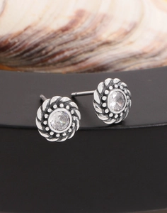 Macro shot of S925 sterling silver twist earrings with clear round zirconia stones