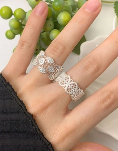 Close-up of wide honeycomb silver ring with micro-rhinestones and lace mesh design