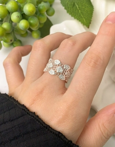 Close-up of wide S925 silver honeycomb lattice ring with micro-pave zircons on finger
