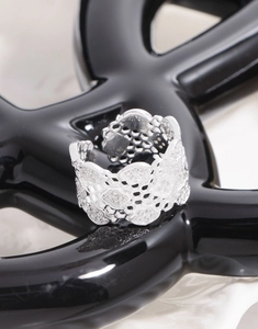 Macro detail of honeycomb lattice S925 sterling silver wide ring with micro-pave crystals