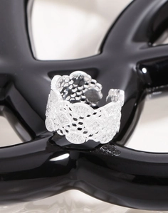 Close-up of S925 sterling silver mesh lace ring with floral hollow honeycomb texture