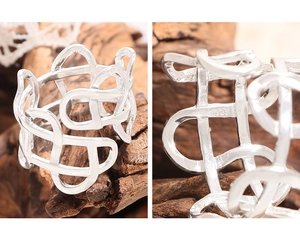 Macro view of S925 sterling silver stamp on the irregular woven hollow ring band