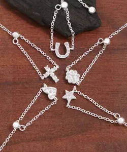 Macro detail of adjustable S925 sterling silver rings with heart and star charms