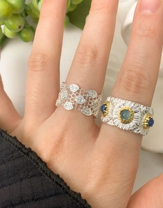 Detailed view of S925 silver wide lace rings with blue gemstone and honeycomb design