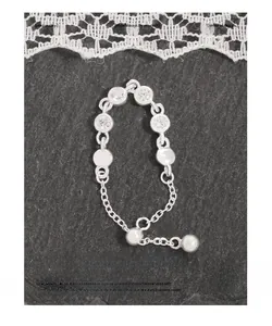 Detailed macro view of S925 sterling silver chain ring with zircons and polished beads