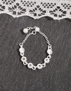 Close-up of S925 sterling silver stamp on minimalist zircon chain adjustable ring