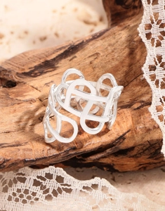 Detailed close-up of S925 sterling silver wide ring with hollow geometric weave design