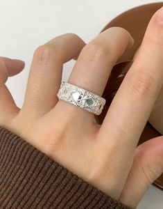 Close-up of S925 sterling silver wide band ring with vintage woven lace texture