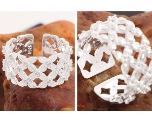 Macro detail of S925 sterling silver mesh ring with woven hollow pattern and hallmark