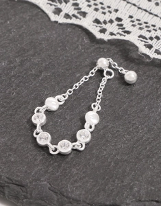 Macro view of S925 sterling silver chain ring featuring four sparkling round zircons
