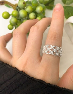 Lattice design S925 sterling silver ring with cubic zirconia worn by a model