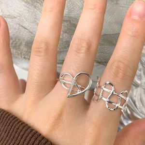 Irregular woven and heart knot S925 sterling silver rings displayed on hand