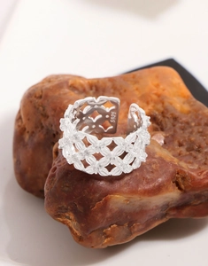 Macro shot of S925 sterling silver mesh lace ring with fine cubic zirconia on stone