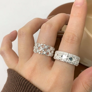 Elegant S925 sterling silver rings with woven lace texture and geometric cut patterns