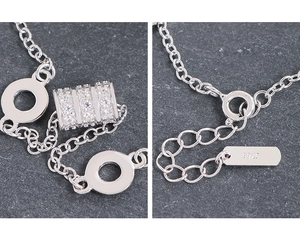 Detail of S925 sterling silver bracelet showing zircon cylinder and hallmark tag