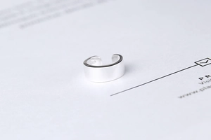 Macro shot of polished S925 sterling silver U-shaped clip with hallmark engraving