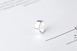 Close-up of S925 sterling silver stamp on minimalist U-shaped ear cuff