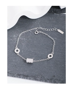 Detailed close-up of S925 sterling silver bracelet with sparkling zircon cylinder pendant