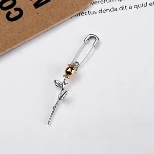 Minimalist S925 sterling silver safety pin earrings with a golden rose flower design