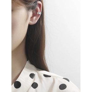 Minimalist S925 sterling silver U-shaped ear cuff worn on the ear cartilage