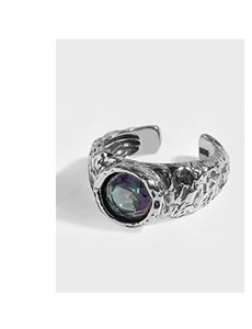 Detail of S925 silver ring with hammer texture and colorful iridescent gemstone