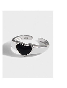 Macro shot of S925 sterling silver ring featuring a black heart gemstone and polished finish