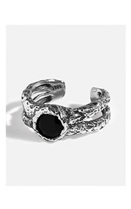Macro shot of S925 sterling silver ring featuring vintage lava texture and black enamel detail