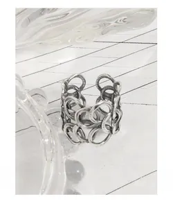 Close-up of S925 sterling silver ring with interlocking chain design and vintage finish