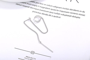 Detail of S925 sterling silver ear cuff with chain and sleek vertical bar drop earring
