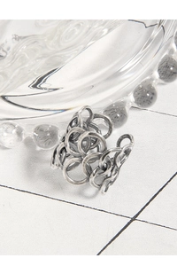 Macro detail of retro S925 sterling silver multilayer intertwined open ring for women