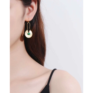 Elegant gold drop earrings with green malachite stone inlay in a minimalist retro style