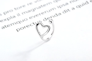 Detailed view of 925 silver open ring with minimalist heart and bead design details
