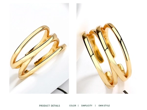 Macro detail of S925 hallmark on minimalist gold-plated multi-layer cross line ring