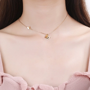 Elegant s925 silver golden double butterfly pendant necklace on female model collarbone