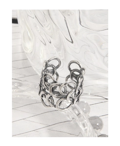 Detail of vintage S925 sterling silver ring with interlocking chain design and antique finish