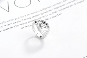 Macro shot of S925 sterling silver ring detail showing the shell texture and metal hallmark