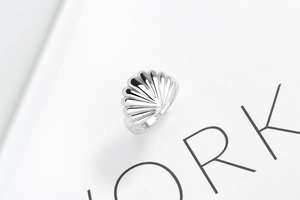 Close-up of S925 sterling silver shell ring showing radial texture and inner hallmark