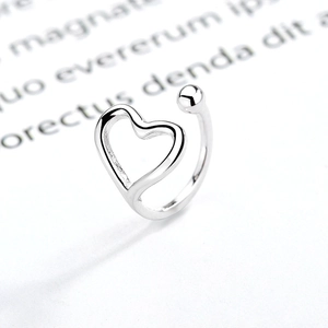 Adjustable S925 sterling silver ring with hollow heart and bead design on paper
